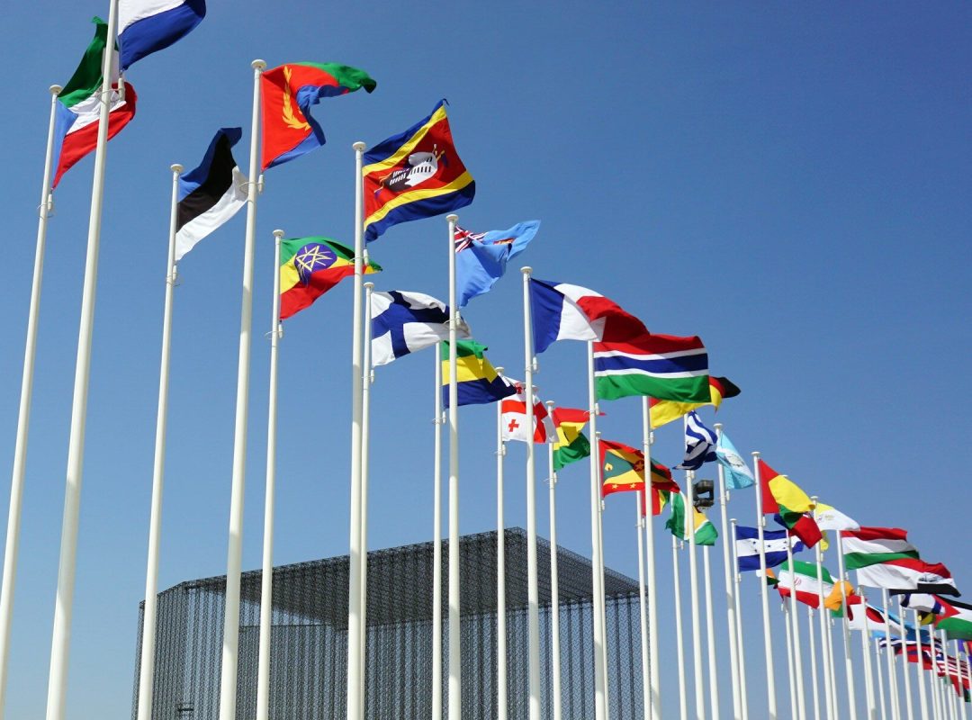 a bunch of flags that are flying in the air